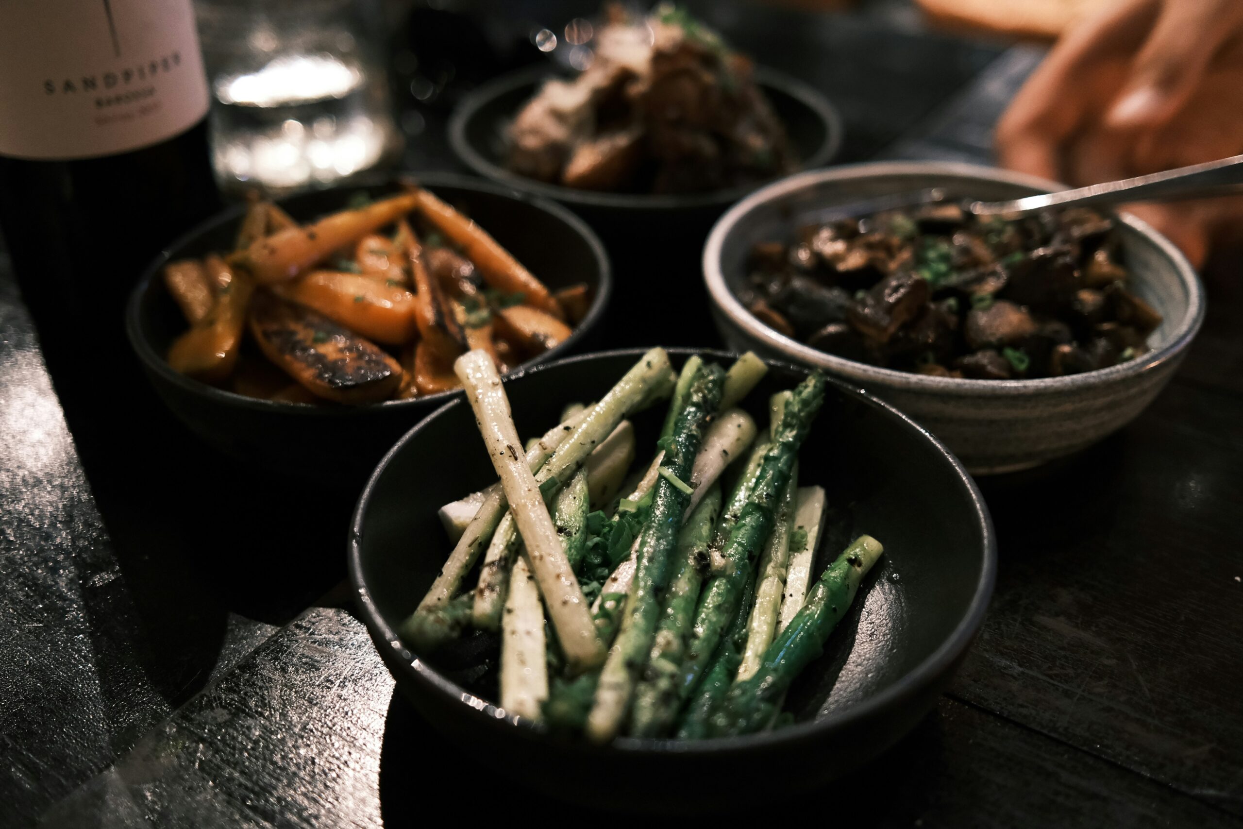 a close up of three bowls of food on a table